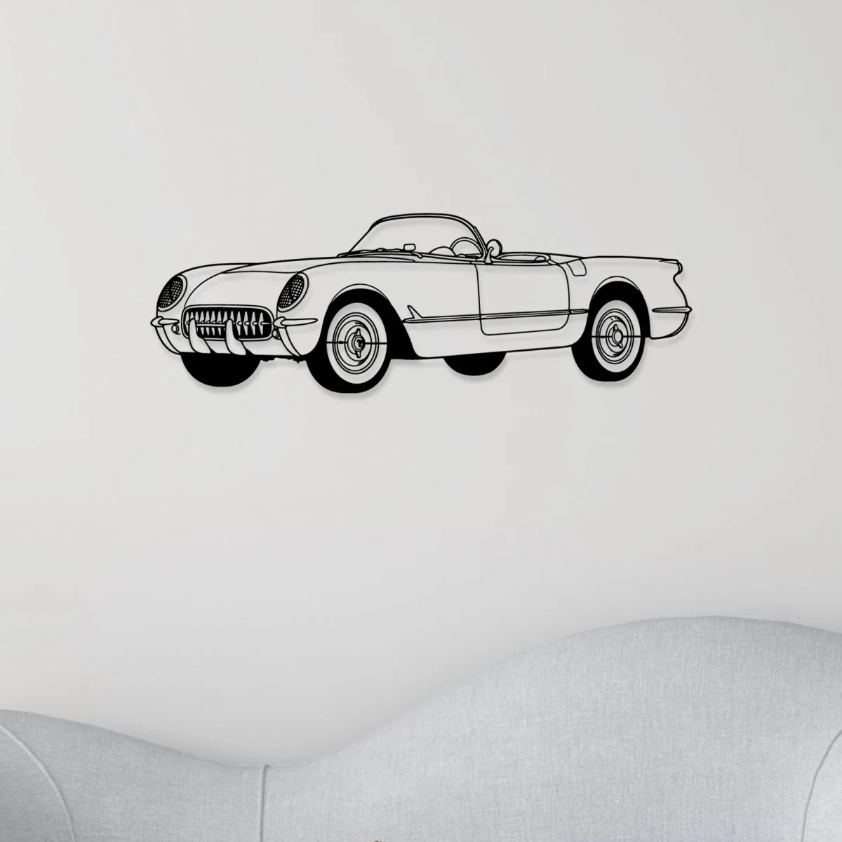 Automotive themed metal wall decor featuring a Corvette
