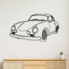 Black metal outline art of a 1960 Porsche 356B on a white wall.