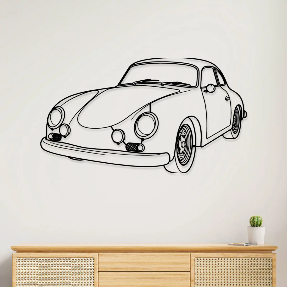 Black metal outline art of a 1960 Porsche 356B on a white wall