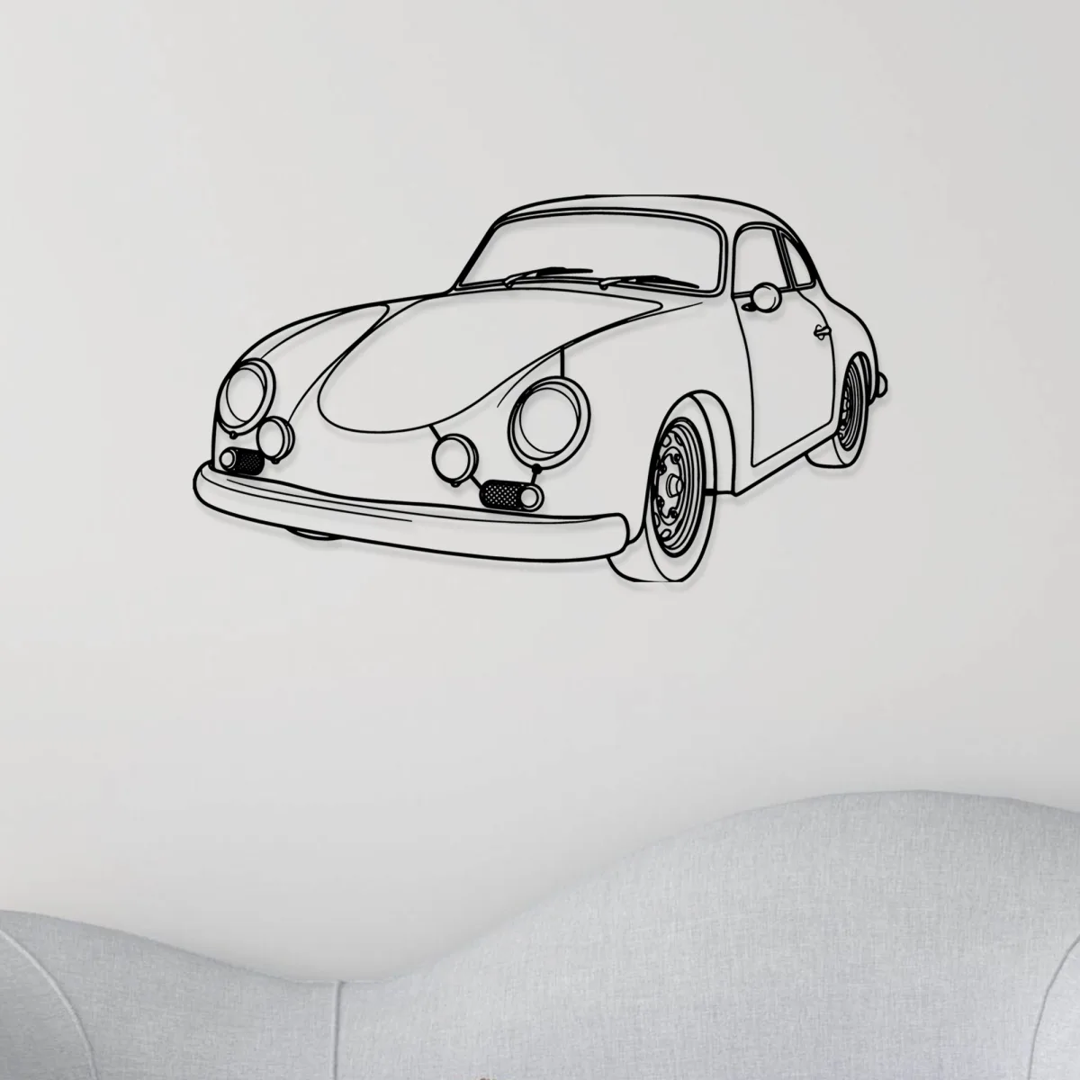 Porsche 356B metal art hanging above a wooden cabinet