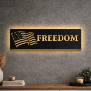Large American Flag Freedom metal sign with optional LED backlighting on a concrete wall.