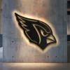 Black metal Arizona Cardinals logo wall art with bright LED backlight.