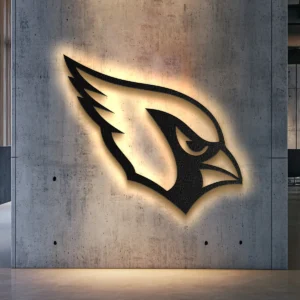 Black metal Arizona Cardinals logo wall art with bright LED backlight on concrete wall.
