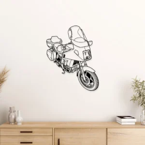 Black metal BMW K100LT motorcycle wall art on a white wall.