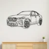 Black metal outline art of a BMW X6 M SUV on a white wall.