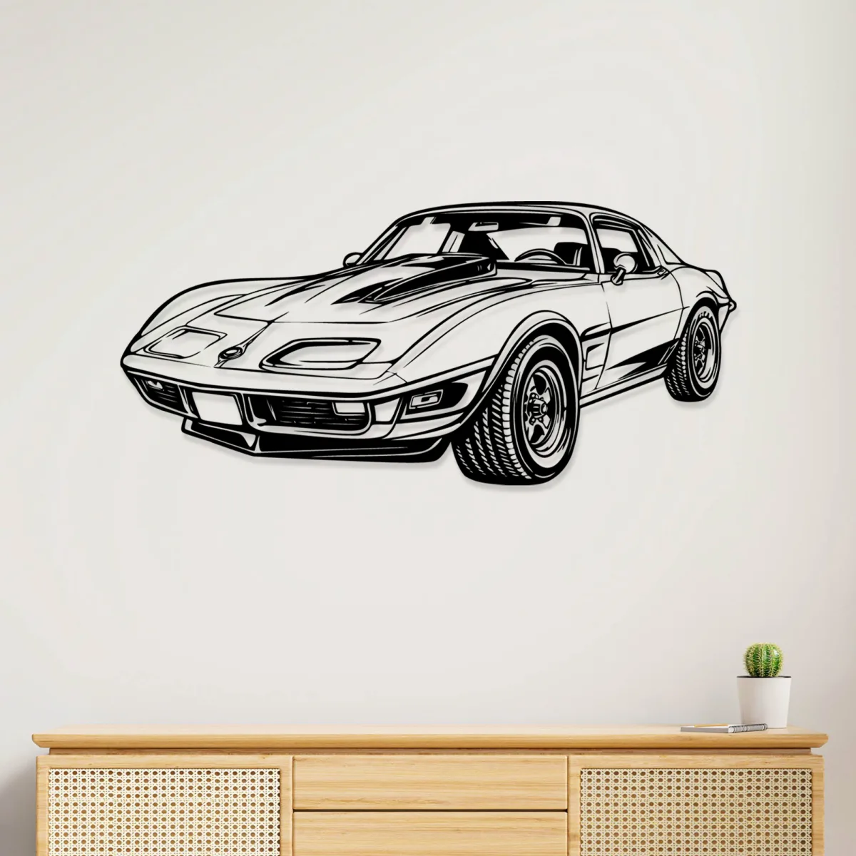 Black metal silhouette of a Chevrolet Corvette C3 wall art on a white wall