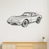 Black metal silhouette of a Chevrolet Corvette C3 on a white wall.