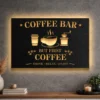 A large black metal coffee bar sign with gold lettering and an LED backlight.