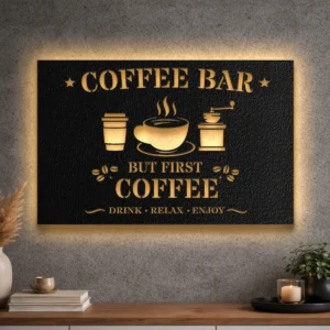 A large black metal coffee bar sign with gold lettering and an LED backlight