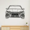 Black custom Audi RS3 front metal wall art with 'YOUR TEXT' on license plate, hanging on a white wall above a wooden cabinet.