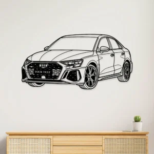 Black metal Custom Audi RS3 silhouette wall art with 'YOUR TEXT' on grille, hanging on a white wall above a wooden cabinet.