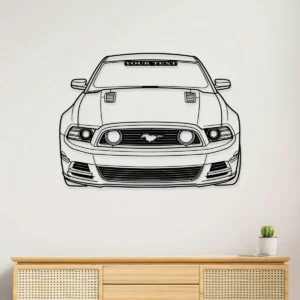 Black outline metal art of a Ford Mustang GT front view on a white wall.