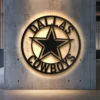 Black metal Dallas Cowboys star logo wall art with optional LED backlight.