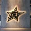 Black metal Dallas Stars logo wall art with LED backlight.
