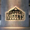 Black metal Denver Nuggets logo wall art with bright LED backlight.