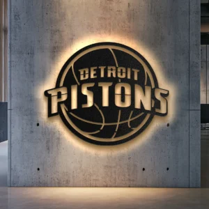 Black metal Detroit Pistons logo wall art with golden details and warm LED backlight.