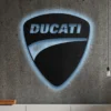 Black metal Ducati logo wall art with blue LED backlight