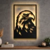 A large black Eagle Head metal wall art with optional LED backlighting on a textured gray wall.