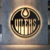 Black metal Edmonton Oilers logo wall art with bright LED backlighting.
