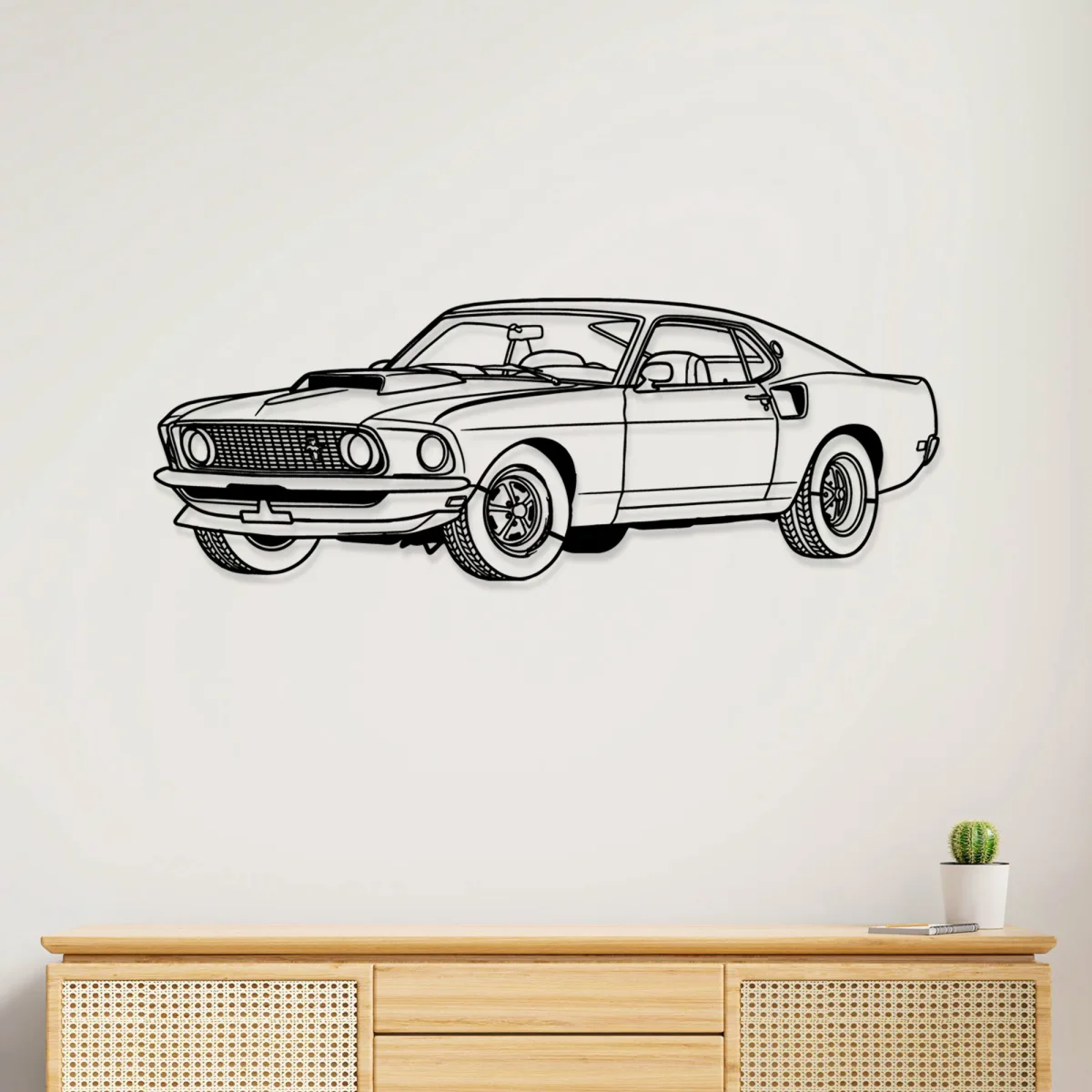 Black metal outline of a 1969 Ford Mustang Boss 429 on a white wall