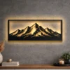 A large rustic metal mountain range wall art with a warm LED backlight.