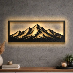 A large rustic metal mountain range wall art with a warm LED backlight