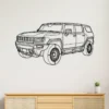 GMC Hummer EV metal wall art silhouette hanging on a white wall.