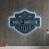 Black metal Harley Davidson logo wall art with blue LED backlight.