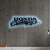 Black metal Honda Racing logo wall art with blue LED backlight.