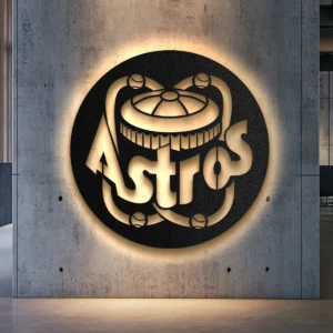 Black metal Houston Astros logo wall art with bright LED backlight on a concrete wall.