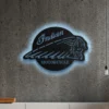 Black metal Indian Motorcycle logo wall art with blue LED backlight.