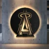 Black metal Los Angeles Angels logo wall art with bright LED backlighting.