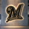 Black metal Milwaukee Brewers M logo wall art with warm LED backlight.
