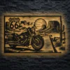 Large rustic metal art depicting a motorcycle on Route 66 in the desert.