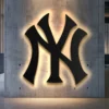 Black metal New York Yankees logo wall art with bright LED backlight.