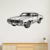Black metal Oldsmobile 442 silhouette wall art on a white wall.