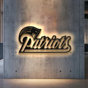 Black metal New England Patriots logo wall art with bright LED backlight on a concrete wall.