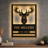 Oversized personalized deer head metal sign with family name.
