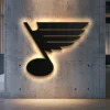 Black metal St. Louis Blues logo wall art with LED backlight.