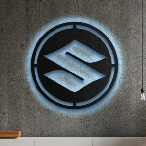 Black metal Suzuki logo wall art with blue LED glow on concrete wall.