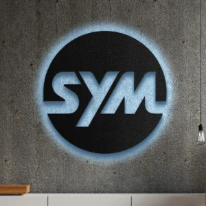 Black metal Sym logo wall art with blue LED backlight on a concrete wall.