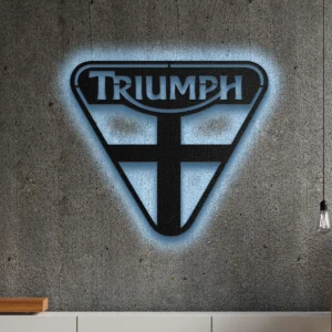 Black metal Triumph logo wall art with blue LED glow on a concrete wall.