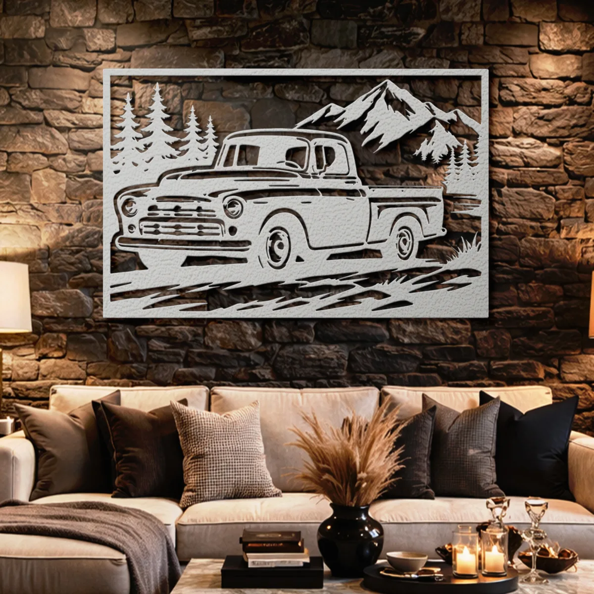 Detailed metal art of a truck in a mountain landscape