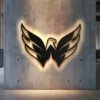 Black metal Washington Capitals logo wall art with bright LED backlighting.