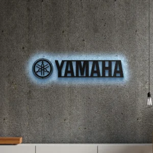 Black metal Yamaha logo wall art with blue LED backlight.
